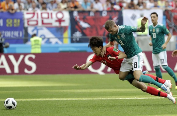 Germany&#039;s Toni Kroos, right, challenges for the ball South Korea&#039;sÂ LeeÂ Jae-sung, left, during the group F match between South Korea and Germany, at the 2018 soccer World Cup in the Kazan A ...