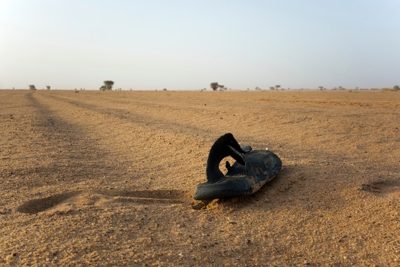 FILE - A sandal lies on the ground in Niger's desert region of the south central Sahara, Sunday, June 3, 2018. (AP Photo/Jerome Delay, File)
Niger Desert
