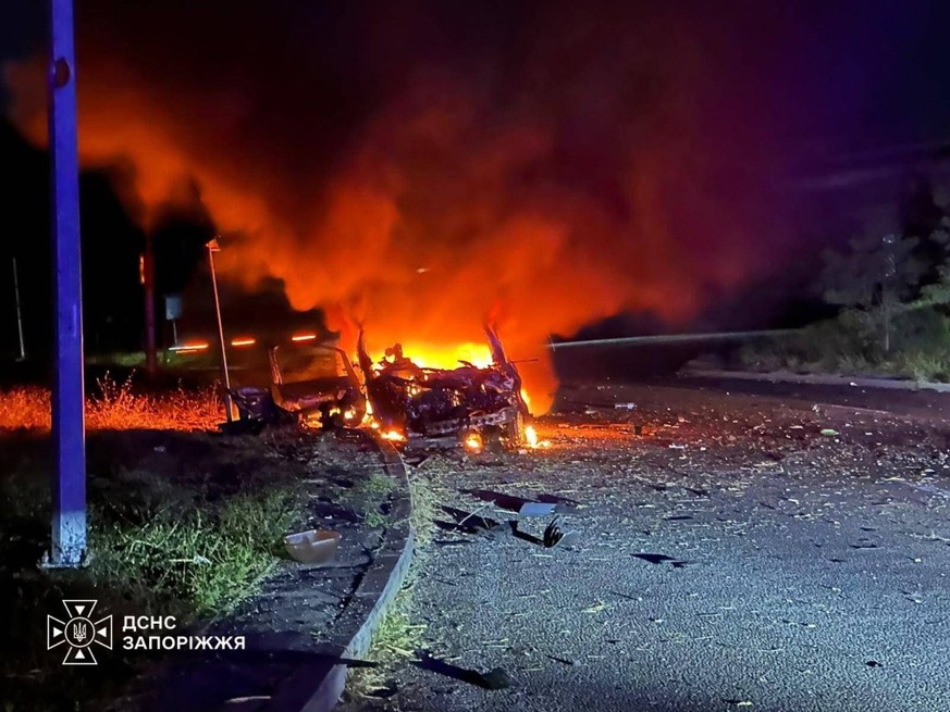 In this photo provided by the Ukrainian Emergency Services on Tuesday, Oct. 6, 2026, a car burns after a Russian strike on a bridge across Dnipro in Zaporizhzhia, Ukraine. (Ukrainian Emergency Service ...
