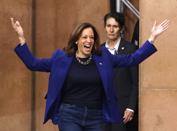 epa11695488 Democratic presidential candidate US Vice President Kamala Harris reacts as she takes the podium to speak at a campaign rally at Craig Ranch Regional Park in North Las Vegas, Nevada, USA,  ...
