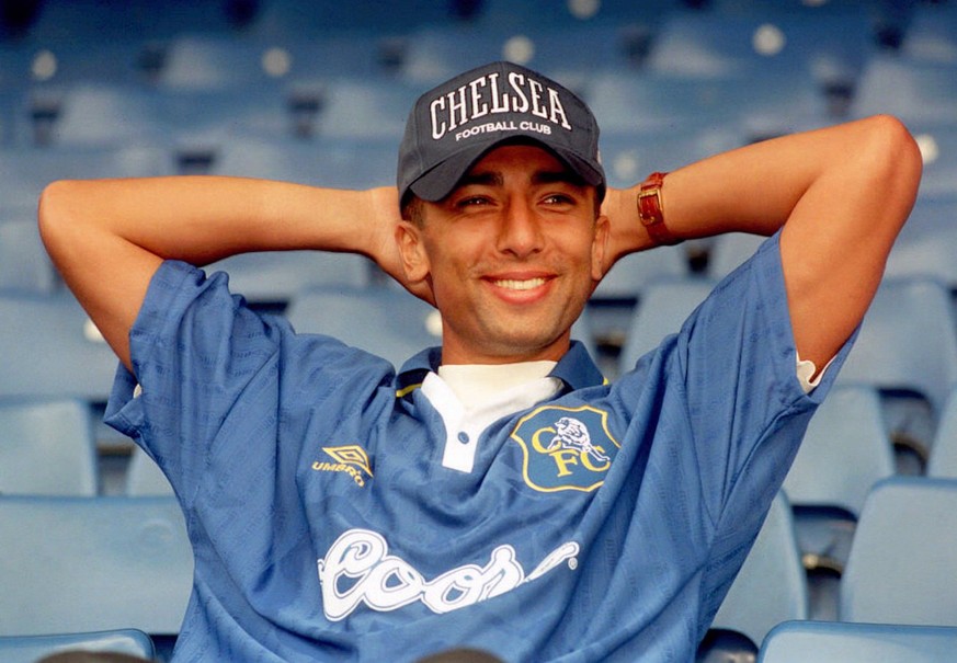 New Chelsea signing Roberto di Matteo smiles for the cameras after signing for the Stamford Bridge, London, club from Lazio in a club-record 4.9 million pounds (dlrs 7.3 million) deal. The 26-year-old ...