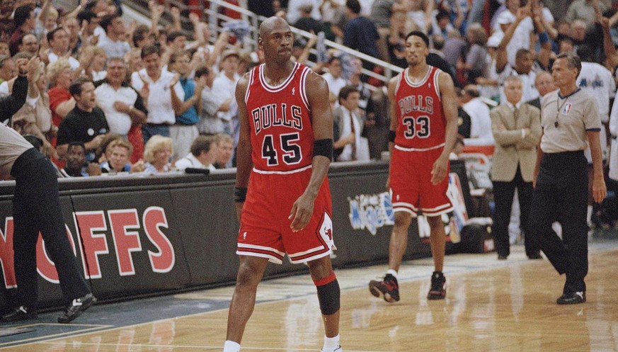 Chicago Bulls guard Michael Jordan (45) and forward Scottie Pippen (33) walk back to the bench during a timeout with 1.5 seconds left and the Orlando Magic leading 94-91 during their first playoff gam ...