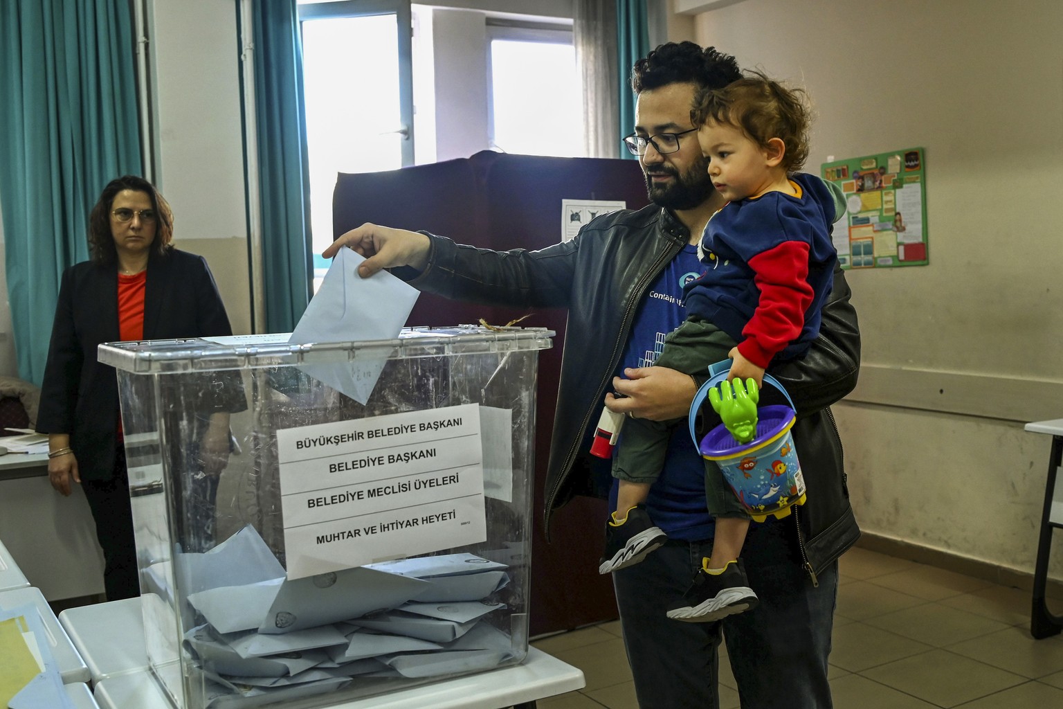 A man votes at a polling station in Ankara, Sunday, March 31, 2024. Turkey is holding local elections on Sunday that will decide who gets to control Istanbul and other key cities. (AP Photo/Ali Unal)