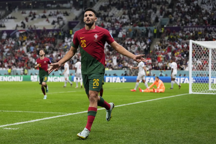 Portugal&#039;s Goncalo Ramos celebrates after scoring his his side&#039;s third goal during the World Cup round of 16 soccer match between Portugal and Switzerland, at the Lusail Stadium in Lusail, Q ...