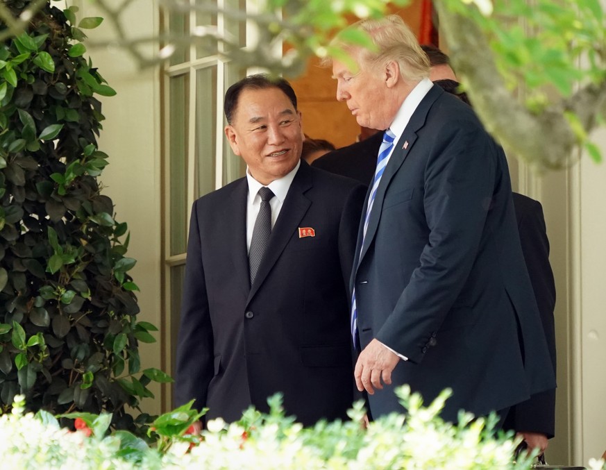 President Donald Trump talks with Kim Yong Chol, left, former North Korean military intelligence chief and one of leader Kim Jong Un&#039;s closest aides, as they walk from the Oval Office at the Whit ...