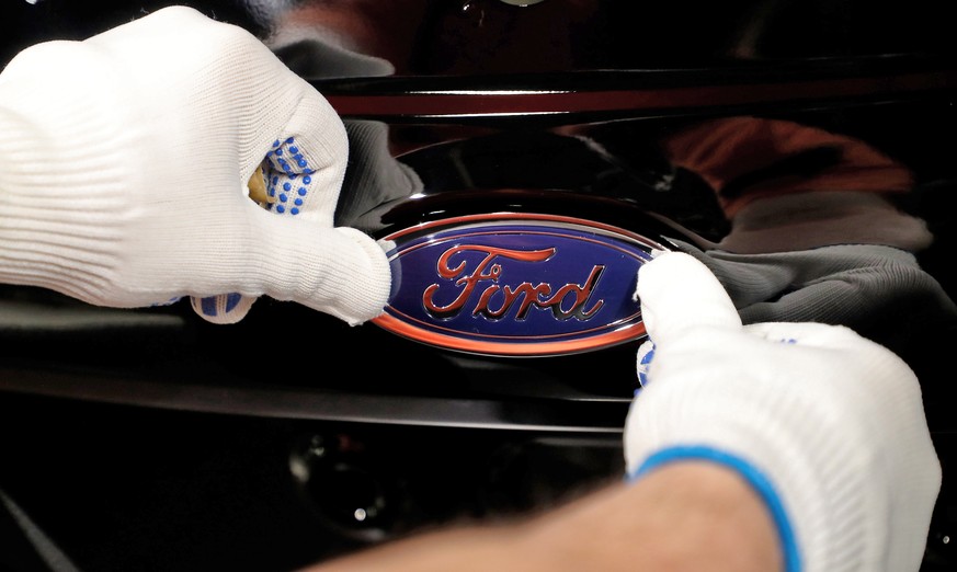 epa07314696 (FILE) - A worker attaches the Ford logo to a Fiesta car at the US car manufacturer plant Ford in Cologne, Germany, 18 January 2019 (reissued 24 January 2019). Ford on 23 January 2019 said ...