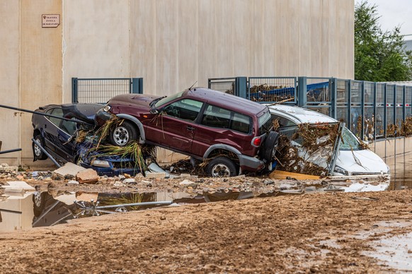epa10839720 Damaged cars at the industrial park after heavy rains in Toledo, Spain, 04 September 2023. Heavy rains registered throughout the country have caused two dead, two missing people and severa ...