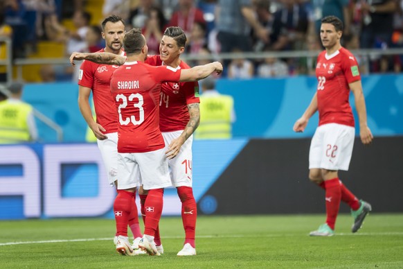 Switzerland&#039;s midfielder Steven Zuber, center, celebrates after scoring a goal with Switzerland&#039;s forward Haris Seferovic, Switzerland&#039;s midfielder Xherdan Shaqiri, and Switzerland&#039 ...