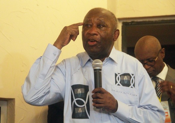 epa09281393 Former Ivorian president Laurent Gbagbo gestures as he speaks to supporters at the Ivorian Popular Front (FPI) offices in Abidjan, Ivory Coast, 17 June 2021. Former president Gbagbo return ...