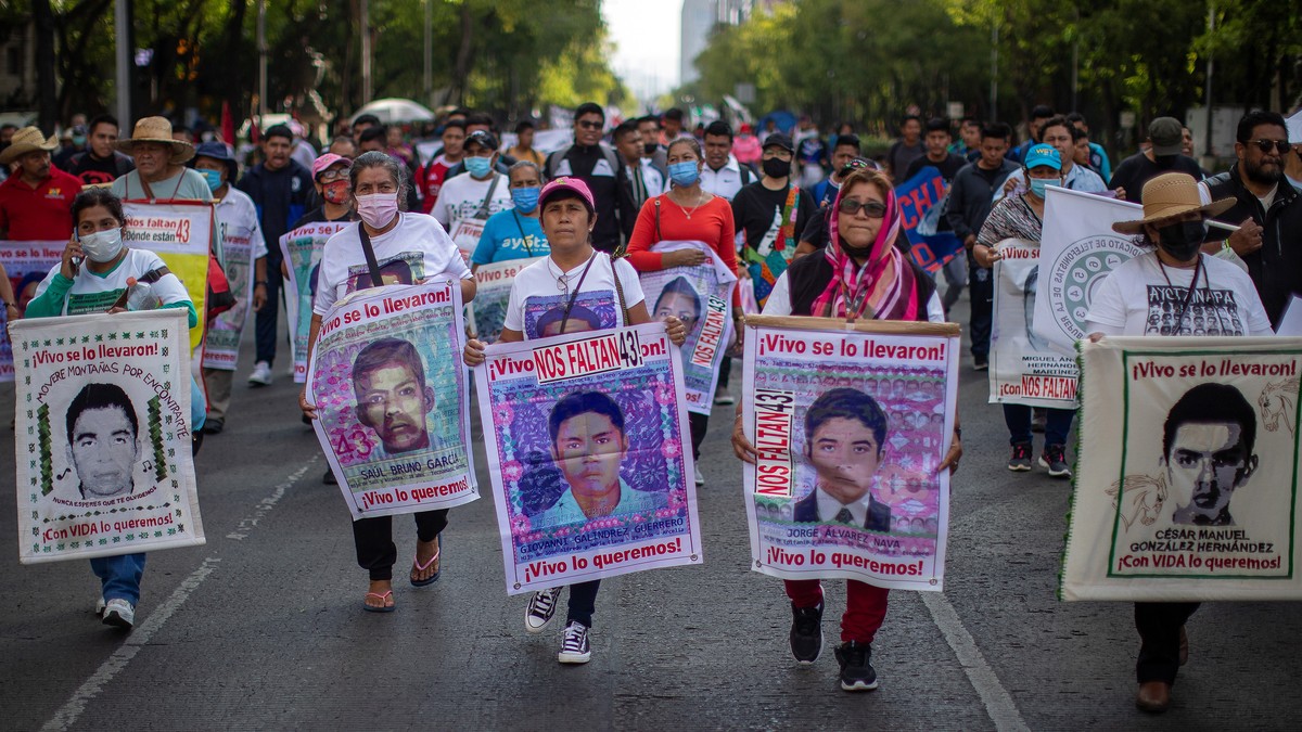 epa09978909 Hundreds of people protest the disappearance of 43 Ayotzinapa students in Mexico City, Mexico, 26 May 2022. The Attorney General's Office (FGR) of Mexico reported that it extradited t ...
