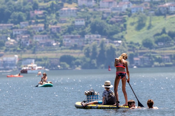 Swimmers seek relief from the heat in the waters of the River Maggia, in Ticino, a level 3 heatwave warning is in place due to high temperatures and sweltering heat; today the temperature reached 35°C ...