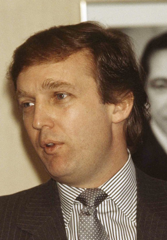Real estate tycoon and owner of the New Jersey Generals football team speaks at a news conference about plans for a new sports stadium in New York City, Feb. 8, 1984. (AP Photo/Mario Suriani)