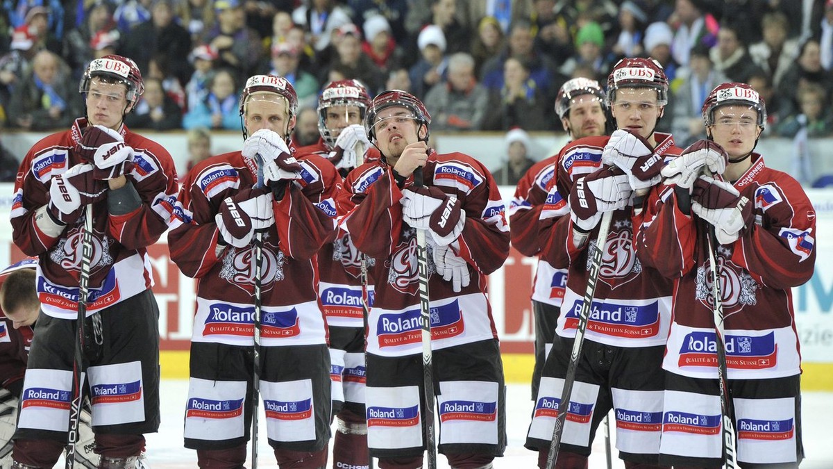 Riga's players are disappointed after the final game between HC Davos and Dynamo Riga at the 85th Spengler Cup ice hockey tournament, in Davos, Switzerland, Saturday, December 31, 2011. (KEYSTONE ...