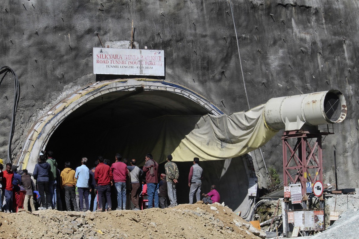 People watch rescue and relief operations at the site of an under-construction road tunnel that collapsed in mountainous Uttarakhand state, India, Wednesday, Nov. 15, 2023. Rescuers have been trying t ...