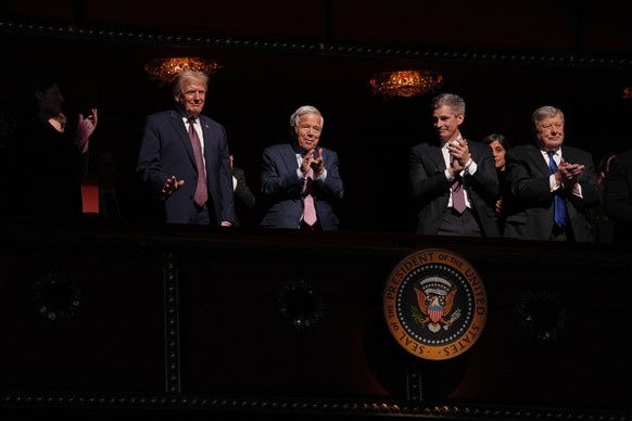 President Donald Trump listens as first lady Melania Trump speaks before the premiere of her movie "Melania" at The John F. Kennedy Memorial Center For The Performing Arts, Thursday, Jan. 29 ...