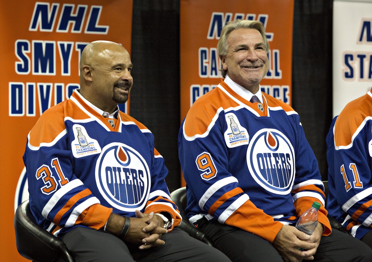 Former Edmonton Oilers' Grant Fuhr, left, and Glenn Anderson take part in the 1984 Stanley Cup NHL hockey reunion media availability in Edmonton, Alberta, Wednesday, Oct. 8, 2014. (AP Photo/The C ...