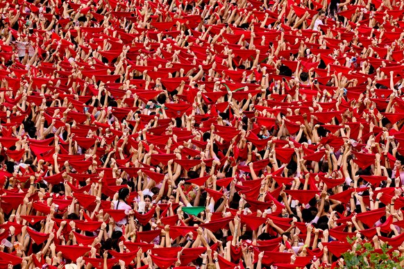 epa10729233 Thousands of people that fill out Castillo Square raise their red scarfs to celebrate the starting of the Sanfermines 2023 in Pamplona, northern Spain, 06 July 2023. Sanfermines runs from  ...