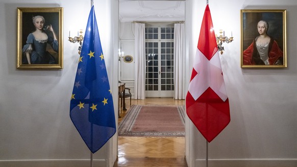 A Swiss flag, right, and an European flag stand in a room before the working visit from Maros Sefcovic, Vice-President of the European Commission by Swiss Federal Councilor Ignazio Cassis, in Bern, Sw ...
