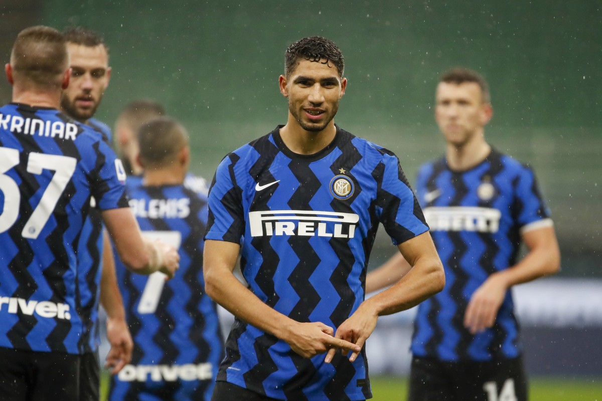 Inter Milan's Achraf Hakimi celebrates after he scored his side's second goal during a Serie A soccer match between Inter Milan and Bologna, at Milan's San Siro Stadium, Saturday, Dec.  ...