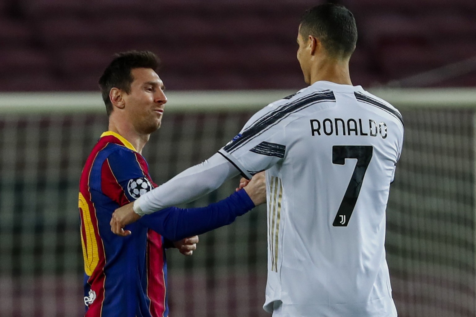 Barcelona&#039;s Lionel Messi, left, shakes has with Juventus&#039; Cristiano Ronaldo prior of the start of the Champions League group G soccer match between FC Barcelona and Juventus at the Camp Nou  ...