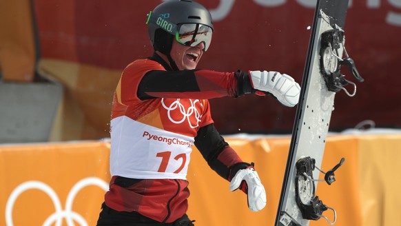 epa06559739 Nevin Galmarini of Switzerland throws his snowboard and yells as he jubilates his win jin the finals of the Men&#039;s Snowboard Parallel Giant Slalom competition at the Bokwang Phoenix Pa ...