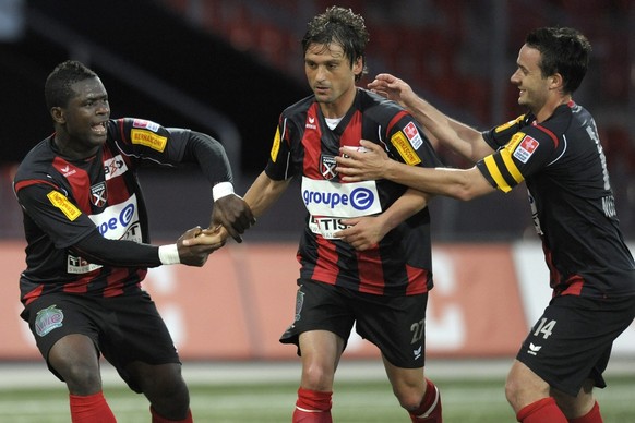 De gauche a droite, les joueurs de Xamax Gerard Gohou Bi Goua, Sanel Kuljic et Raphael Nuzzolo montrent leur joie apres le 3eme buts lors de la rencontre de football de Super League entre le FC Neucha ...