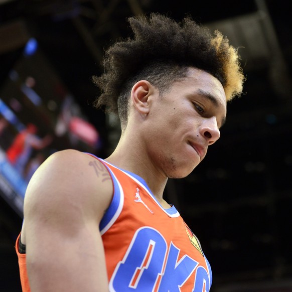 Oklahoma City Thunder guard Tre Mann walks off the court after an NBA basketball game against the Memphis Grizzlies, Thursday, Dec. 2, 2021, in Memphis, Tenn. (AP Photo/Brandon Dill)