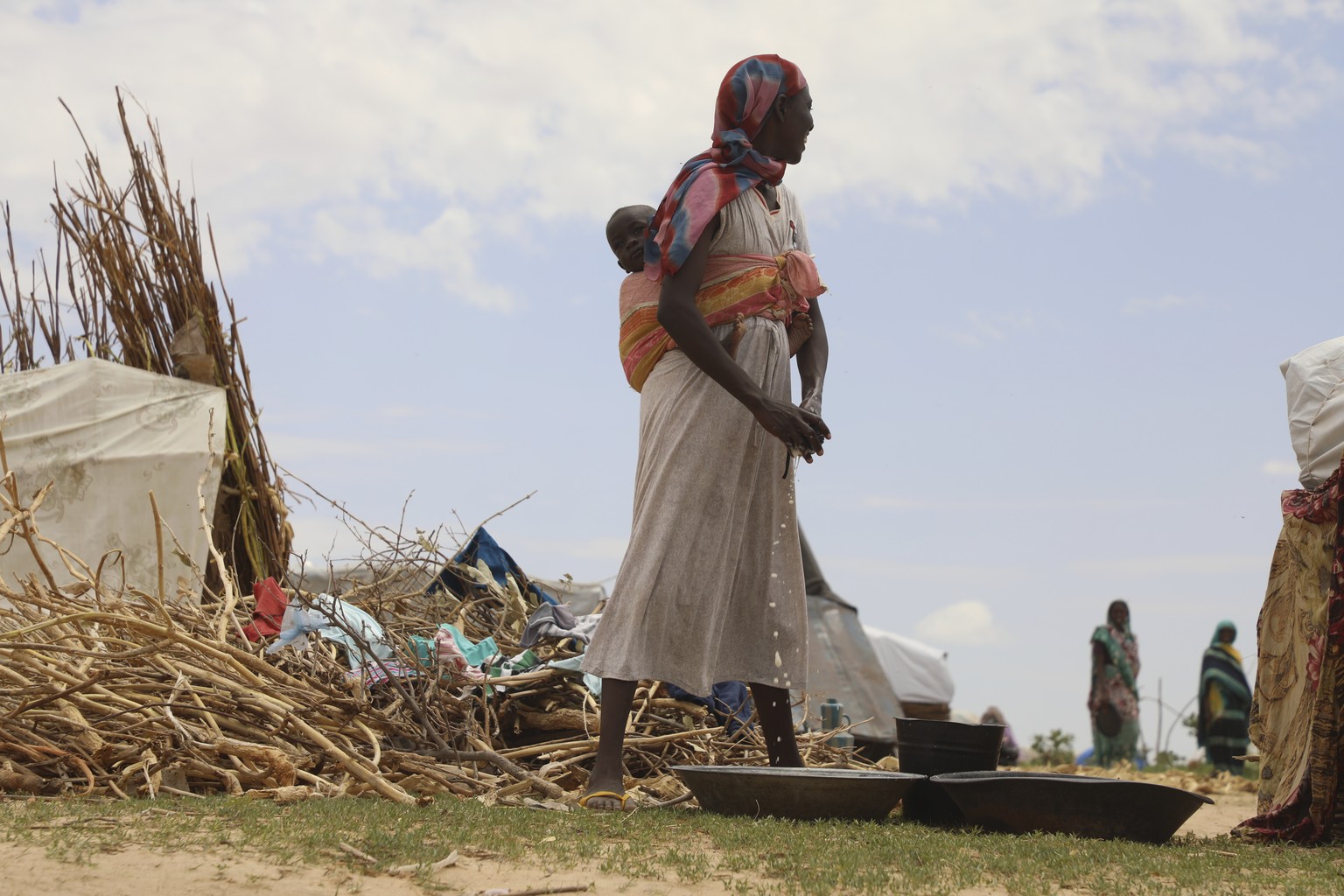 Sudanese refugees who fled the conflict in Sudan gather July 4, 2023 at the Zabout refugee Camp in Goz Beida, Chad. The U.N. says the conflict in Sudan has driven more than 3.1 million people from the ...