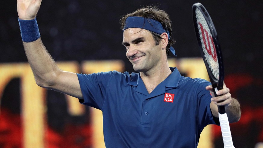 Switzerland&#039;s Roger Federer celebrates after defeating United States&#039; Taylor Fritz during their third round match at the Australian Open tennis championships in Melbourne, Australia, Friday, ...