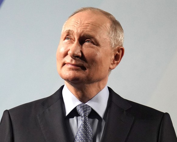 epa10854464 Russian President Vladimir Putin attends the naming ceremony of the Arctic gas tanker Alexey Kosygin and the tanker shuttle Valentin Pikul at the Zvezda shipbuilding complex in Pri...