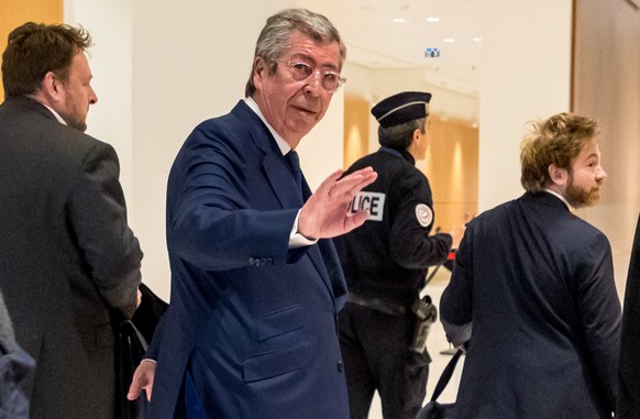 epa07567368 Mayor of Levallois-Perret Patrick Balkany (C) arrives at the Paris courthouse, 13 May 2019. Balkany is being prosecuted with his wife for two counts of tax fraud and he is suspected of hav ...