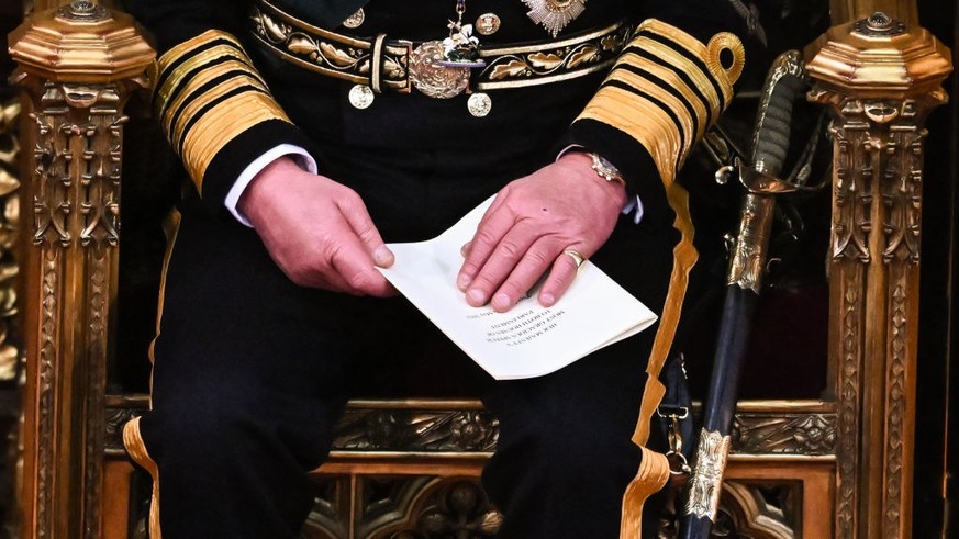 LONDON, ENGLAND - MAY 10: Prince Charles, Prince of Wales holds the Queen&#039;s Speech in his hands after reading it in the House of Lords Chamber, during the State Opening of Parliament in the House ...
