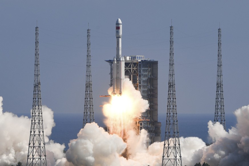 In this photo released by Xinhua News Agency, the Long March-7 Y4 carrier rocket carrying Tianzhou-3 cargo spacecraft lifts off from the Wenchang Space Launch Center in Wenchang in southern China&#039 ...