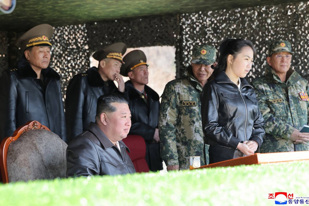 This image, released on March 20, 2026, by the North Korean Official News Service KCNA, shows North Korean leader Kim Jong Un and his daughter, Kim Ju Ae, observing a military exercise involving tanks ...
