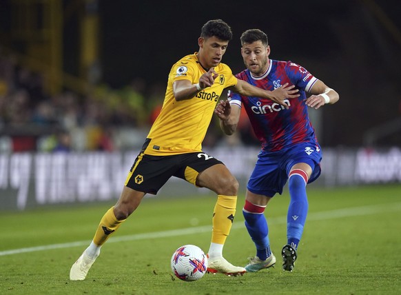 Wolverhampton Wanderers&#039; Matheus Nunes, left, and Crystal Palace&#039;s Joel Ward battle for the ball during the English Premier League soccer match between Wolverhampton Wanderer&#039;s and Crys ...