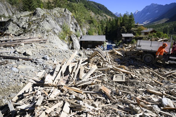epa12389631 Debris is cleared from a destroyed house in the village of Blatten during the groundbreaking ceremony for its reconstruction project, known as &#039;Blatten 2030,&#039; just 3,5 months aft ...