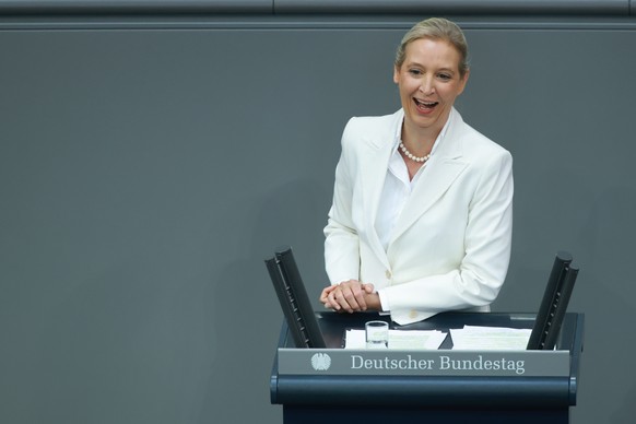 epa13224496 Alternative for Germany (AfD) party and parliamentary group co-chairwoman Alice Weidel smiles as she speaks during a debate at the German parliament, the Bundestag, in Berlin, Germany, 09  ...