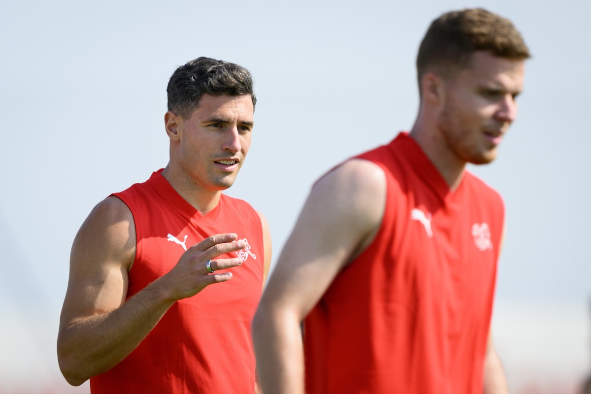 Switzerland's defender Fabian Schaer, left, and Switzerland's defender Nico Elvedi, right, attend a closed training session of Swiss national soccer team on the eve of their FIFA World Cup 2 ...