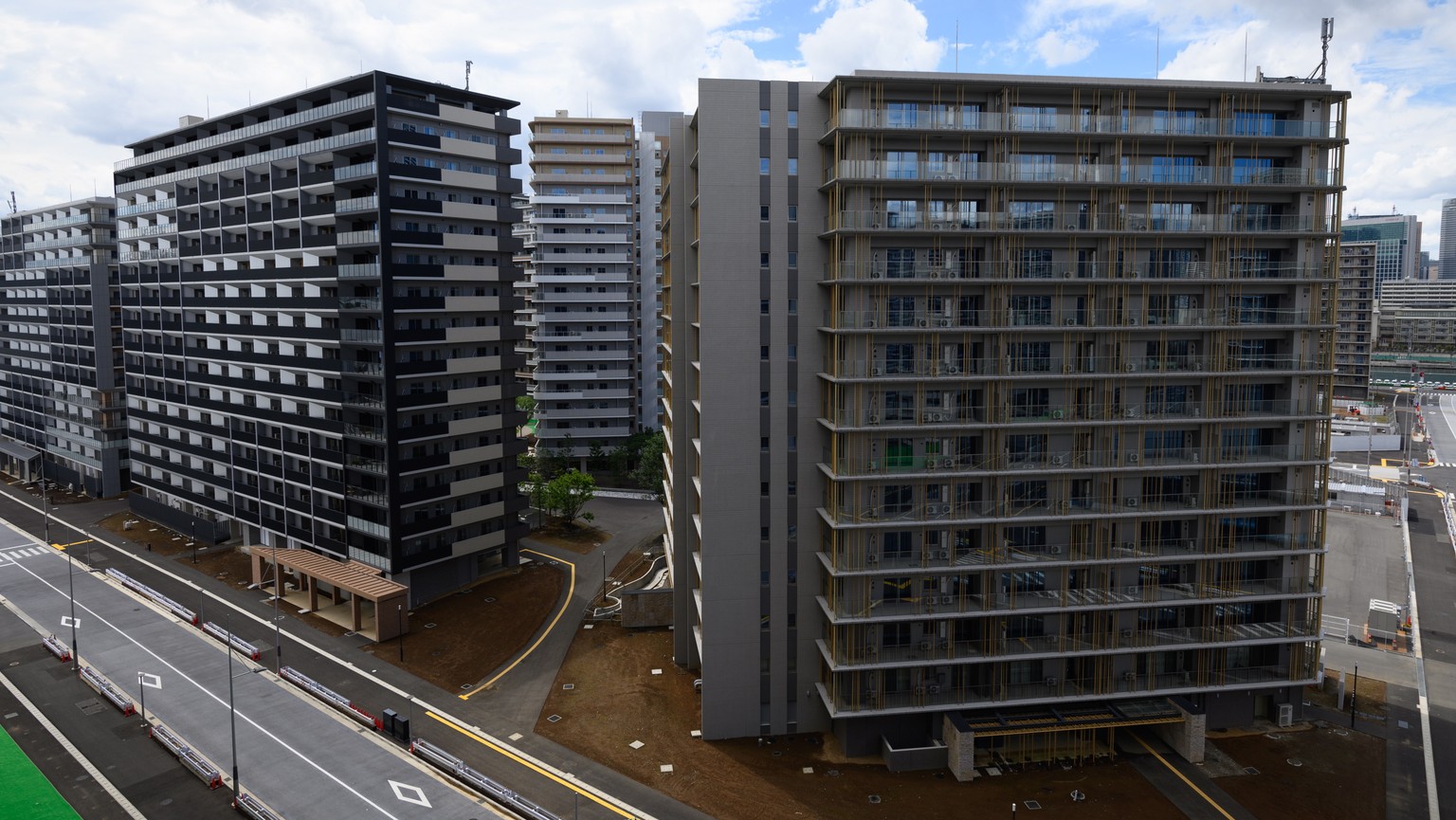 epa09287896 Residential buildings for athletes during a media tour at the Olympic and Paralympic Village for the Tokyo 2020 Games, constructed in the Harumi waterfront district of Tokyo, Japan, 20 Jun ...