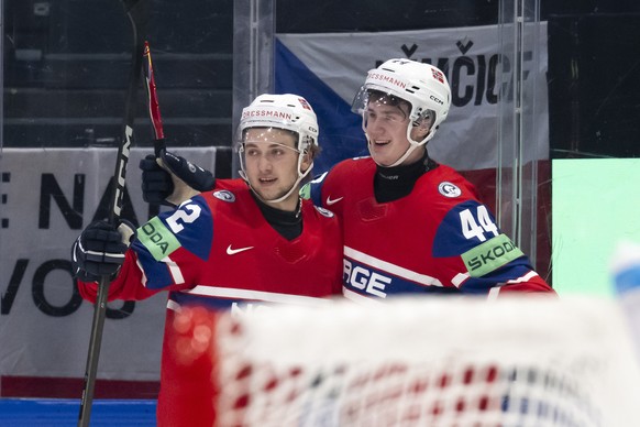 epa12994645 Norway's Tinus Luc Koblar (R) celebrates his goal (1-0) with Norway's Stian Solberg (L) during the 2026 IIHF Men's Ice Hockey World Championship preliminary round Group B ga ...