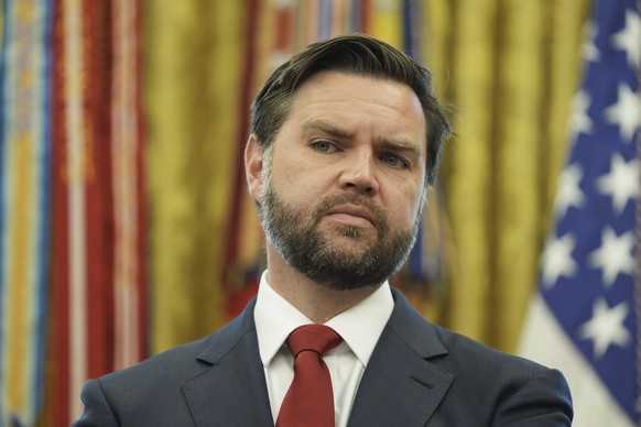 Vice President JD Vance listens as President Donald Trump speaks with reporters after announcing a trade deal with United Kingdom in the Oval Office of the White House, Thursday, May 8, 2025, in Washi ...