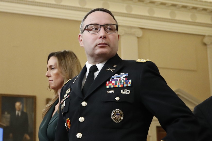 Jennifer Williams, an aide to Vice President Mike Pence, and National Security Council aide Lt. Col. Alexander Vindman, arrive back after a break in their testimony before the House Intelligence Commi ...