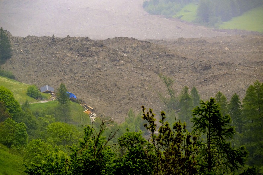 A large avalanche with a mixture of ice, rock, snow and water reach the valley floor is pictured in Wiler after the Birch glacier collapsing above Blatten, Switzerland, Wednesday, May 28, 2025. (KEYST ...