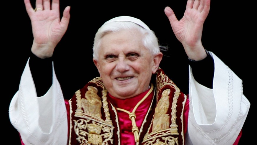 A photograph dated 19 April 2005 showing the newly elected Pope Benedict XVI as he greets pilgrims while standing on the balcony of Saint Peter&#039;s Basilica, in the Vatican, after his election. Car ...