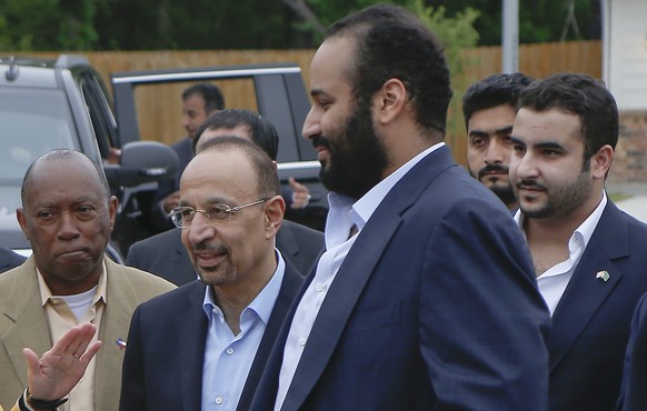 ADDS NAME OF SUSPECT - In this April 7, 2018, file photo, Saudi Crown Prince Mohammed bin Salman, front right, talks with Habitat for Humanity Executive Director Allison Hay, front left, surrounded by ...