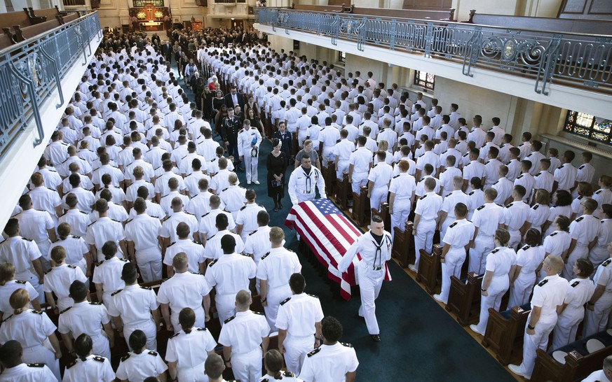 In this image proved by the family of John McCain, the family follows as the casket of Sen. John McCain, R-Ariz., is moved from the Chapel on the grounds of the United States Navel Academy after a ser ...