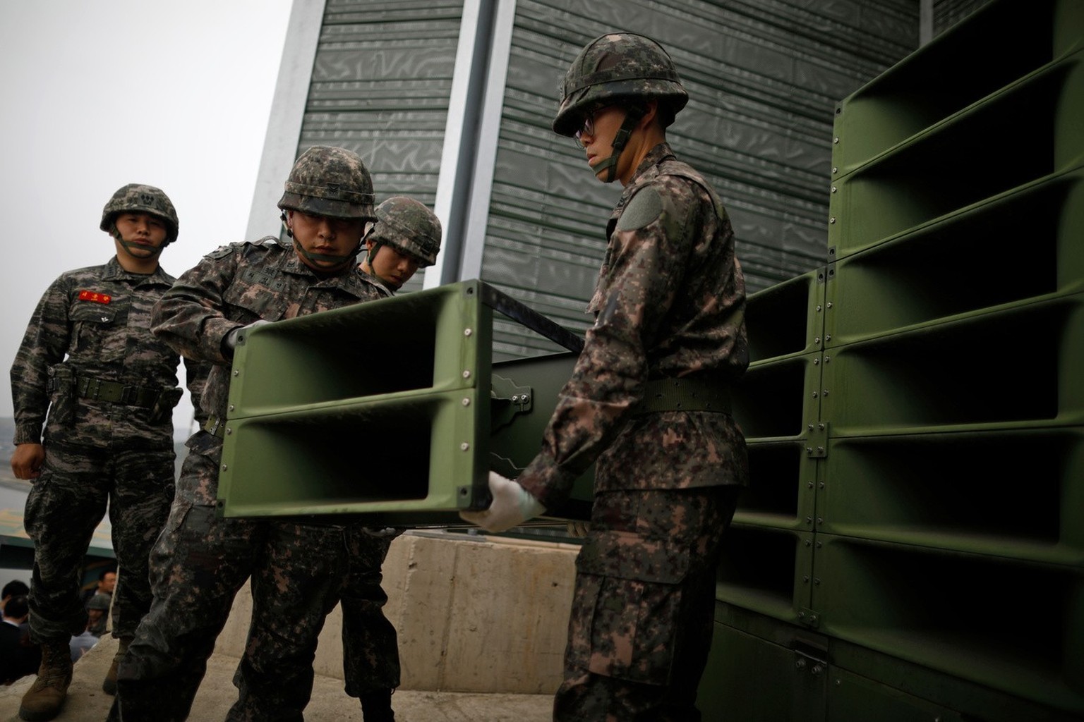 FILE - South Korean soldiers dismantle loudspeakers that set up for propaganda broadcasts near the demilitarized zone separating the two Koreas in Paju, South Korea, on May 1, 2018. Following the susp ...