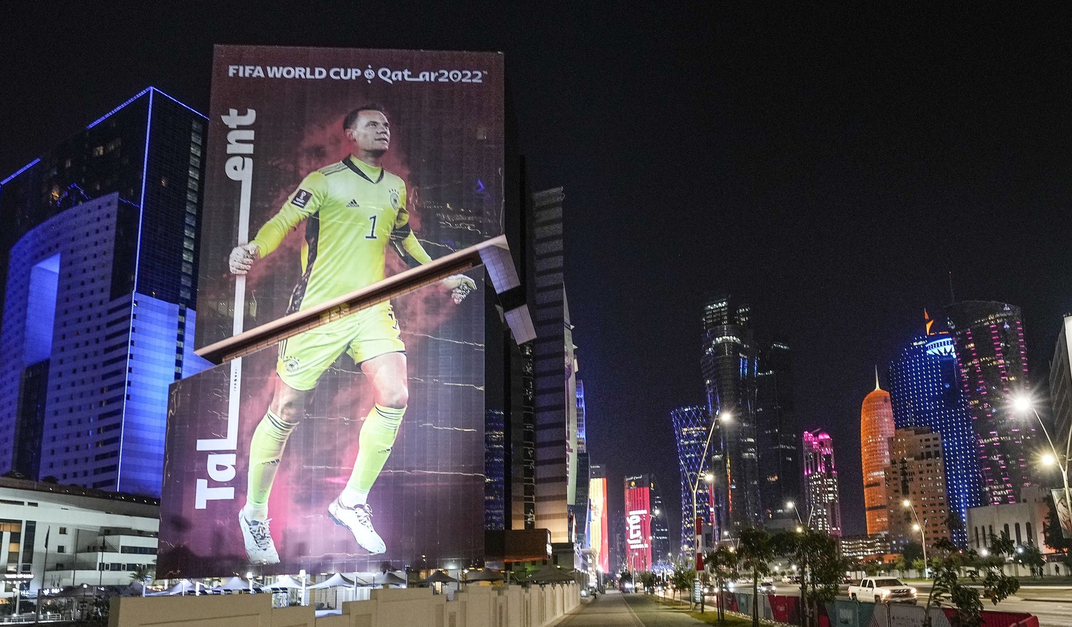 A giant FIFA World Cup advertisement on a skyscraper shows Germany&#039;s goalkeeper Manuel Neuer, reading &quot;talent&quot; in the center of Doha, Qatar, Friday, Nov. 18, 2022. (AP Photo/Martin Meis ...