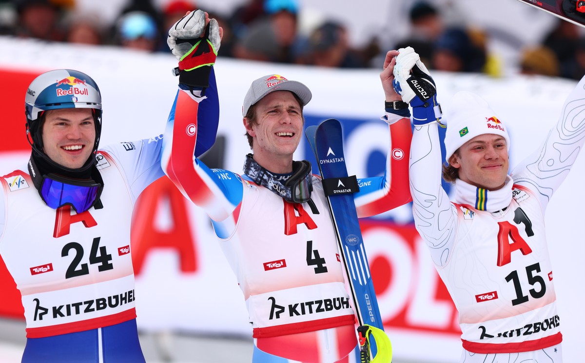 epa11854602 (L-R) Second placed Alex Vinatzer of Italy, first placed Clement Noel of France and third placed Lucas Pinheiro Braathen of Brazil celebrate in the finish area after the Men's Slalom  ...