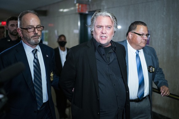 Former White House strategist Steve Bannon is escorted to the courtroom of the Manhattan district attorney's office after surrendering to New York authorities, Thursday, Sept. 8, 2022, in New York. (A ...